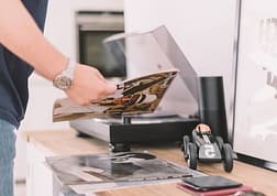 man holding magazine